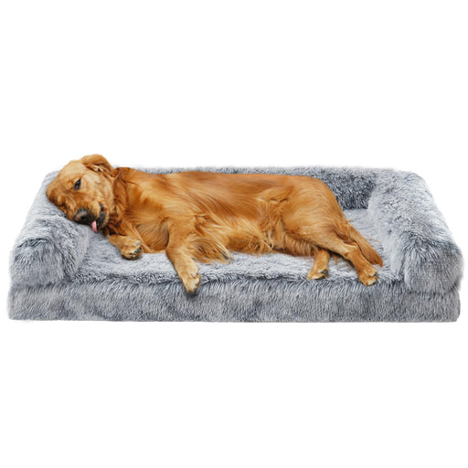 Golden retriever lying on gray fuzzy orthopedic dog bed with raised pillow edges