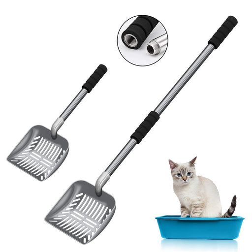 Two metal cat litter scoops with black foam handles and adjustable length poles next to kitten