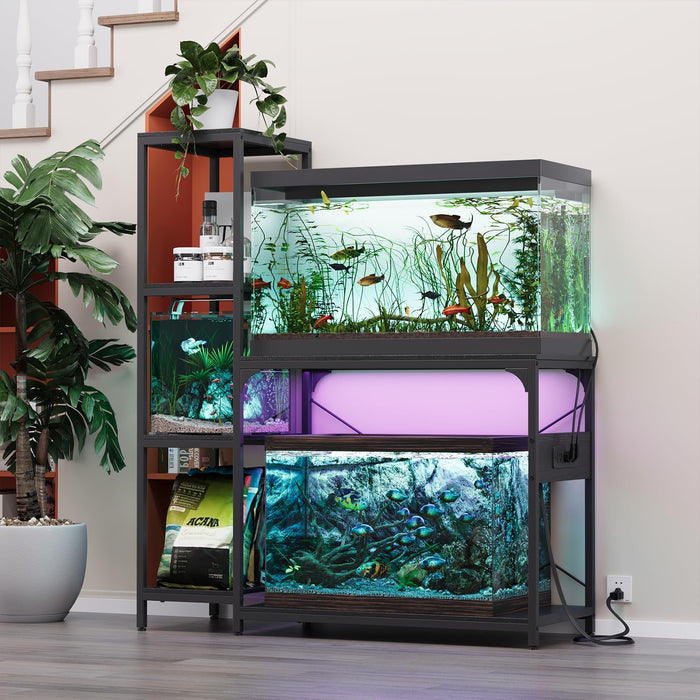 Black metal aquarium stand holding three fish tanks with colorful lighting in modern home setting