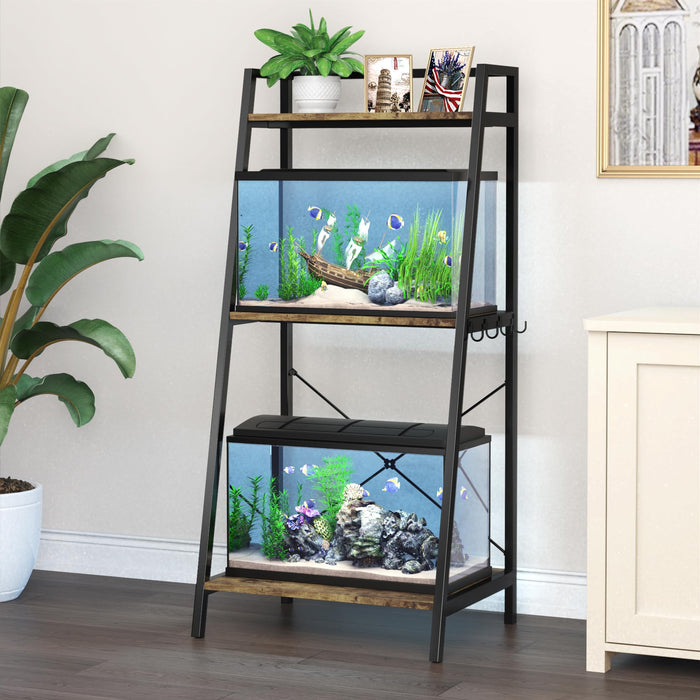 Black metal aquarium stand with two fish tanks in home living room setting with plants