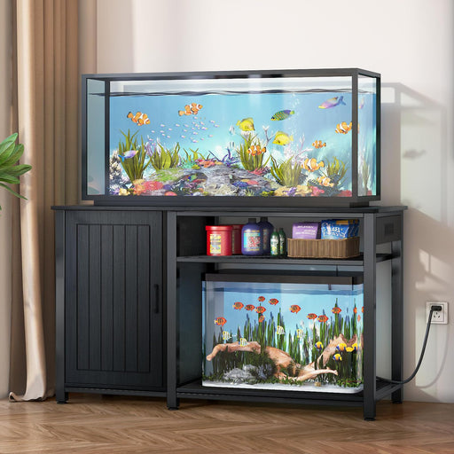 Black wooden aquarium stand with two tropical fish tanks and storage compartments in home setting