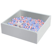 Gray square foam ball pit filled with pastel pink blue and white balls with starfish toy