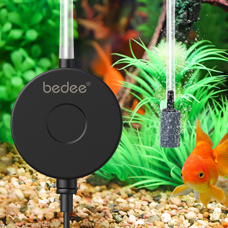 Black Bedee piezo air pump with goldfish and green aquatic plants in colorful aquarium setting