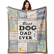 Woman holding up colorful dog dad themed blanket with paw prints and humorous sayings