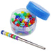 Clear container with blue lid open showing colorful plastic bird bands and metal installation tool