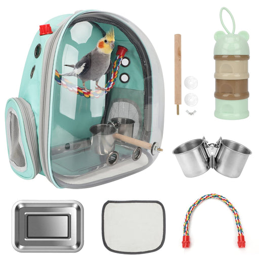 Mint green bird carrier backpack with cockatiel inside and complete accessory kit laid out