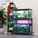 Black metal aquarium stand holding three fish tanks with aquatic plants and colorful lighting