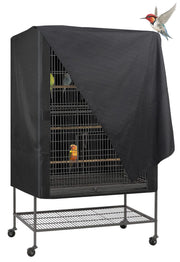 Black bird cage cover partially draped over large flight cage with colorful birds inside
