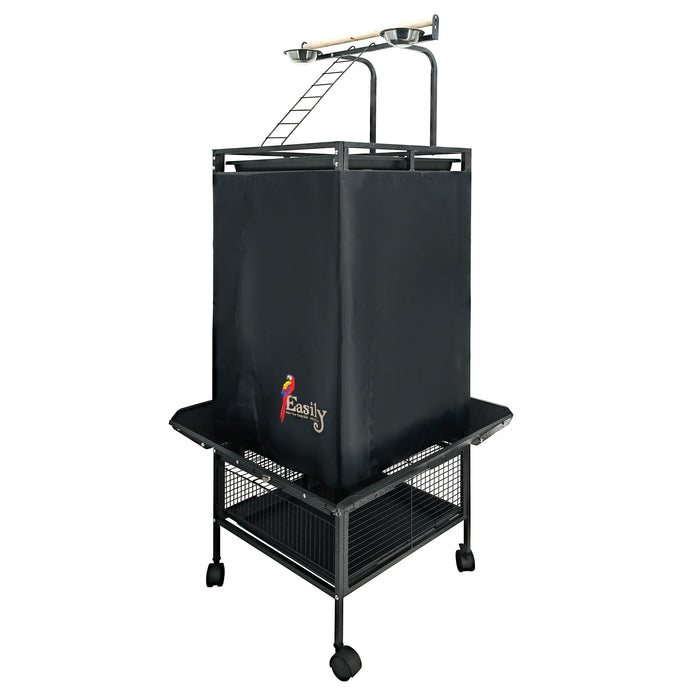 Black fabric bird cage cover on wheeled stand with play top perches and storage basket