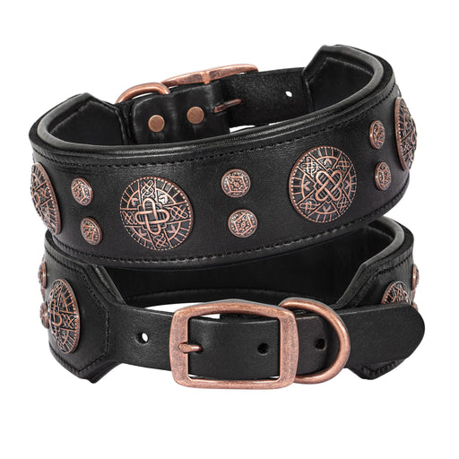 Two black leather dog collars with copper Celtic medallion studs stacked together