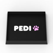 Black silicone dog washing mat with white PEDI text and pink paw print logo on textured surface