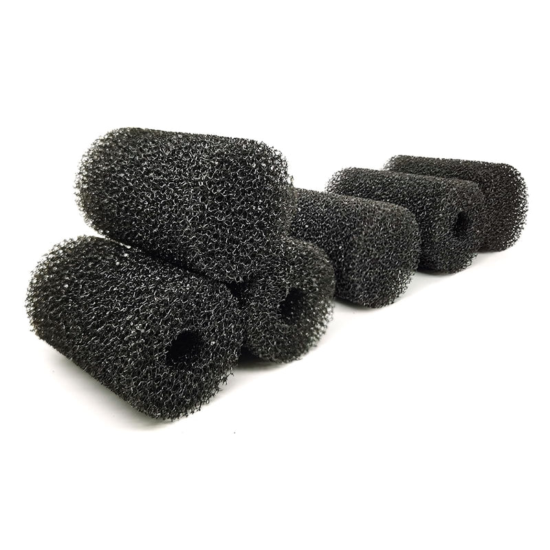 Multiple black aquarium pre-filter sponges arranged on white background showing texture