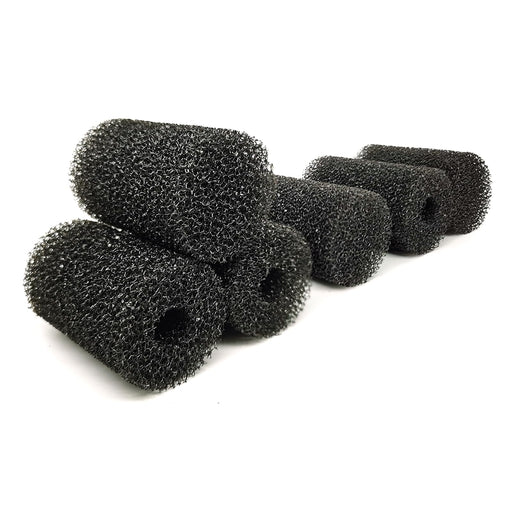 Multiple black aquarium pre-filter sponges arranged on white background showing texture