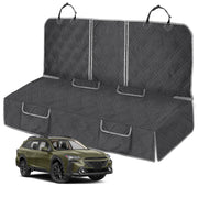 Black quilted dog car seat cover shown flat with Subaru Outback SUV in olive green