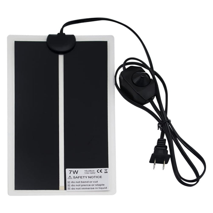 Black rectangular reptile heat pad with white border, power cord and control dial visible