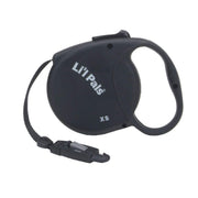 Black retractable dog leash with Li'l Pals branding and XS size marking, showing handle and clip