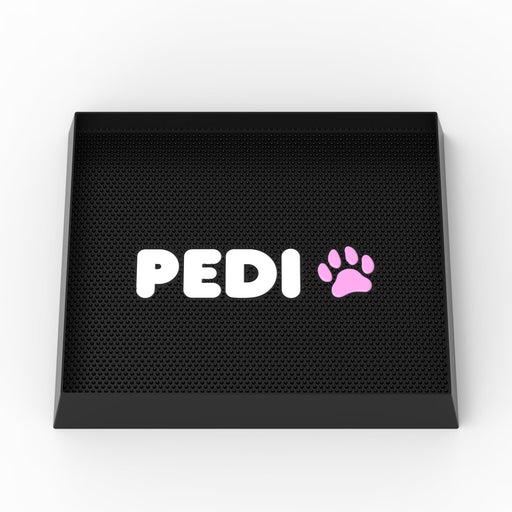 Black silicone dog washing mat with white PEDI text and pink paw print logo on textured surface