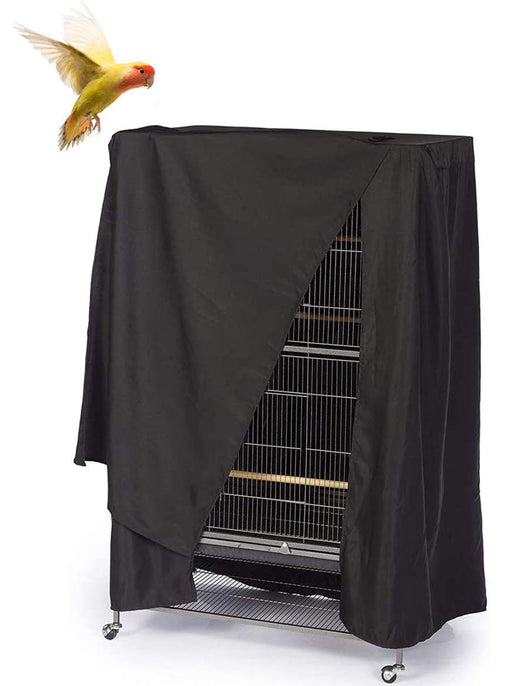 Black waterproof bird cage cover partially draped over tall parrot cage with colorful bird