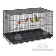 Black wire flight bird cage with colorful parrots inside, showing feeding bowls and perches