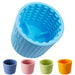 Blue textured dog lick mat with raised bumps and grooves, shown with four colorful variants below
