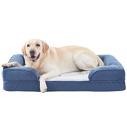 Yellow Labrador retriever lying comfortably on blue memory foam dog bed with raised bolster sides