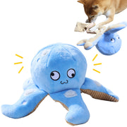 Blue octopus dog toy with cute face and corduroy tentacles being played with by small dog