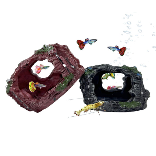 Two broken barrel aquarium decorations with colorful guppies and shrimp swimming around them
