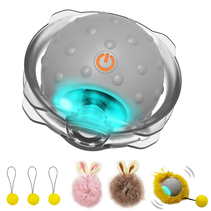 Gray interactive cat ball with orange power button, LED blue light, and fuzzy accessories below