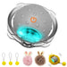 Gray interactive cat ball with orange power button, LED blue light, and fuzzy accessories below