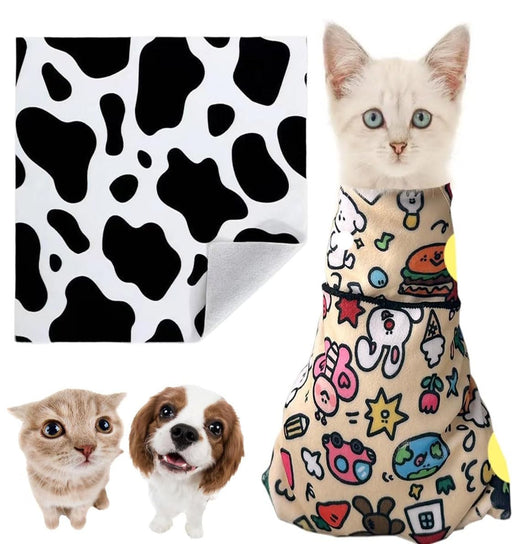 White kitten in colorful patterned grooming wrap with cow print fabric and small dog shown