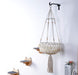 A macrame cat hammock with included wall steps for an elevated sanctuary for your cat.