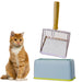 Orange tabby cat sits beside metal litter scoop and blue storage stand on white background