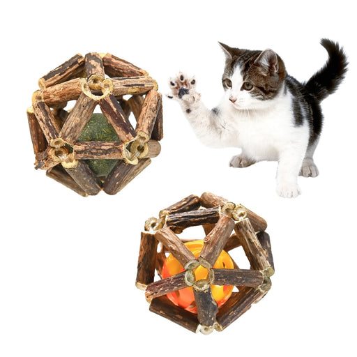 Kitten pawing at hand-woven silvervine ball toys with catnip and bell inserts