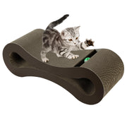 Gray tabby kitten playing on brown corrugated cardboard cat scratching lounge with curved design