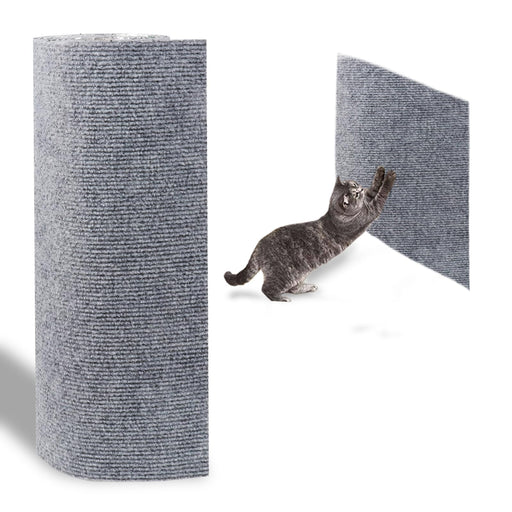 Gray tabby cat stretching and scratching on large gray textured cat scratch mat cylinder
