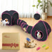 Black and pink cat tunnel system with multiple cats playing, product box and spring toys included