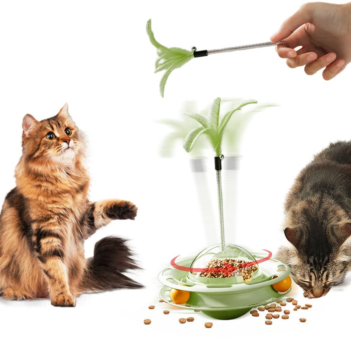 Two cats playing with green 3-level turntable toy with feather wand and scattered kibble