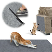 Orange and white cat stretching on blue textured scratch mat with tabby cat using furniture