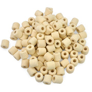 Pile of beige ceramic ring filter media pieces with cylindrical holes scattered on white background