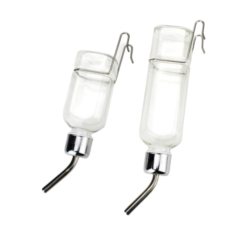 Two clear glass water bottles with metal drinking spouts and wire cage holders on white background
