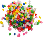 Pile of colorful small aquarium gravel stones in red, blue, green, pink, yellow and white
