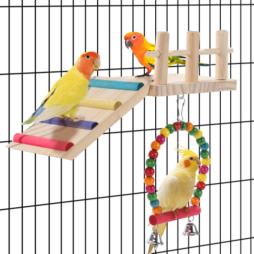 Three colorful parrots playing on wooden ladder with perches and swing toy in bird cage
