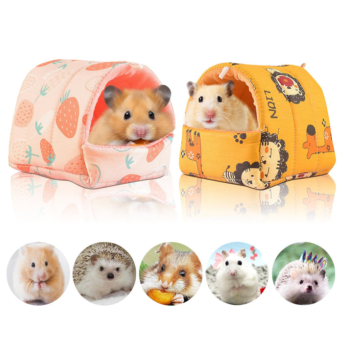 Two colorful fabric hamster hideout houses with cute patterns, one pink with strawberries, one