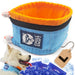 Blue and orange collapsible dog bowl with cooling ice packs and happy husky wearing matching collar