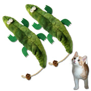Two green plush crocodile cat toys with rope tails beside an orange and white kitten