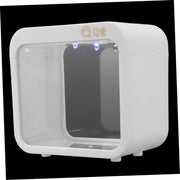 White cube-shaped mini aquarium with LED lights visible at top, shown against black background