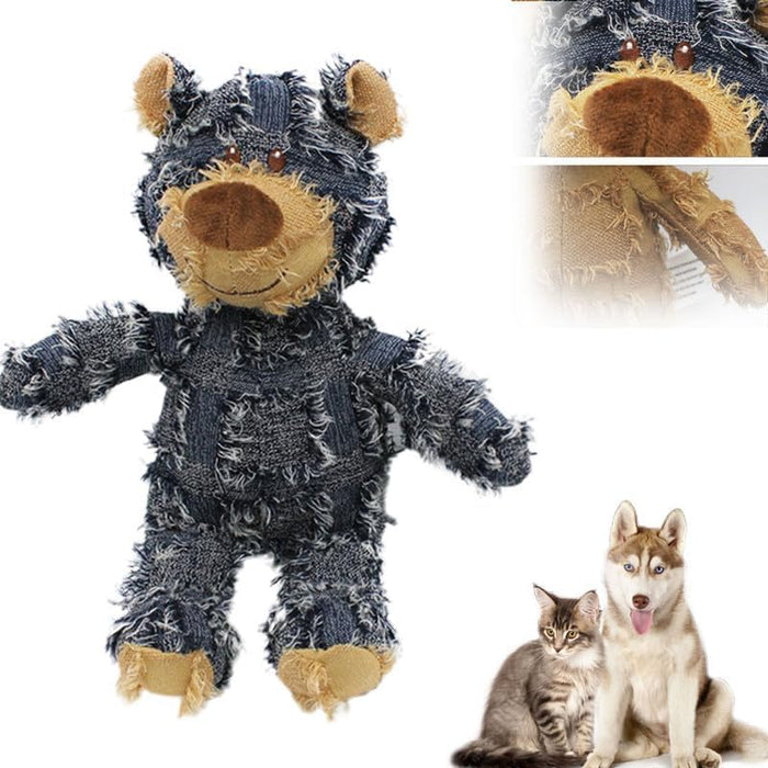 Gray frayed denim bear dog toy with tan snout and paws next to husky and tabby cat