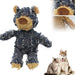 Gray frayed denim bear dog toy with tan snout and paws next to husky and tabby cat