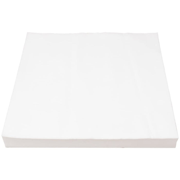 White disposable bird cage liner papers shown as a neat stack from an angled perspective