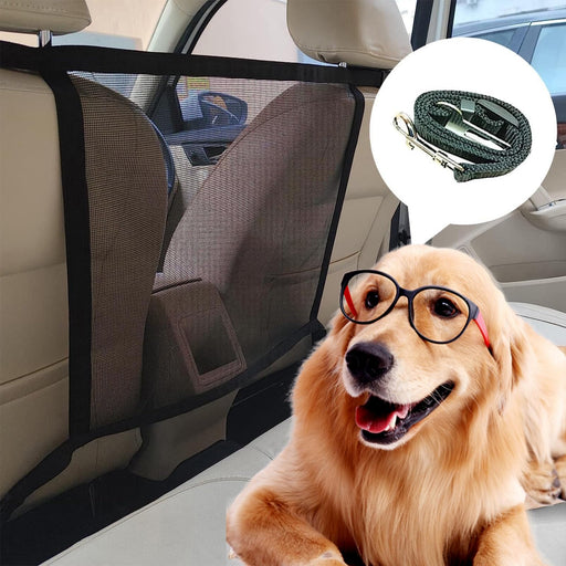 Golden retriever with glasses sits behind black mesh car barrier net in vehicle interior